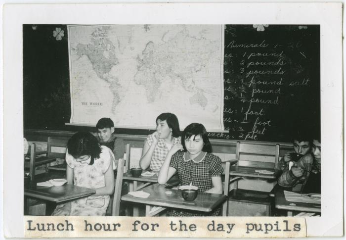 [Day pupils eating lunch, Norway House Indian Residential School]