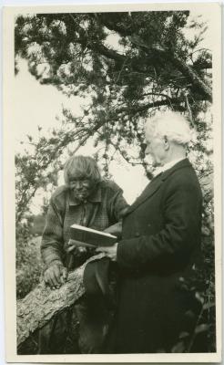 [Rev. J. Maclean reading to John Meneno, aged 95, the last Cree Indian to remember James Evans, Norway House, Man.]