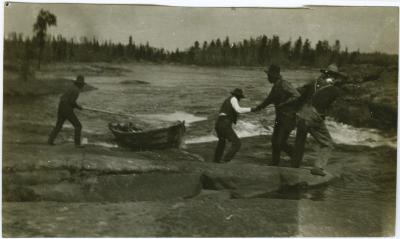 [Cree Indian guides portage across rapids near Norway House]