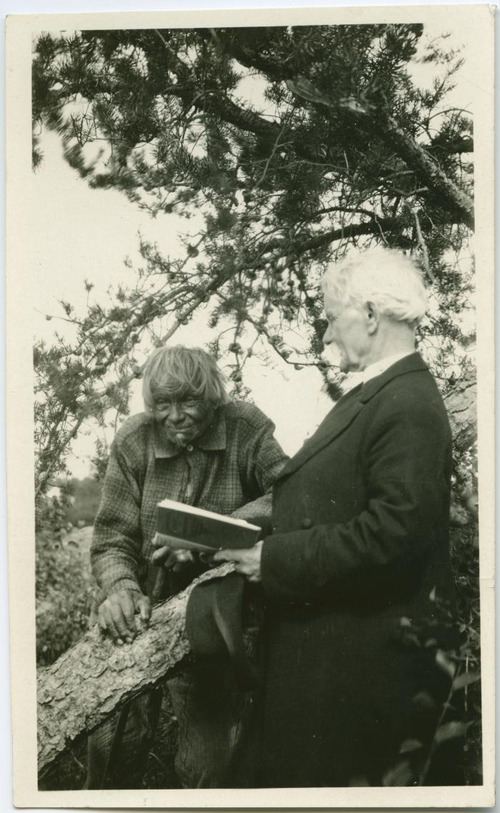 [Rev. J. Maclean reading to John Meneno, aged 95, the last Cree Indian to remember James Evans, Norway House, Man.]