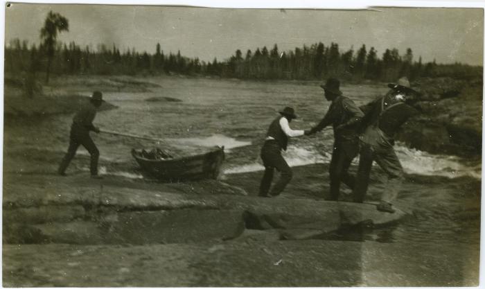 [Cree Indian guides portage across rapids near Norway House]