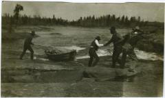 [Cree Indian guides portage across rapids near Norway House]
