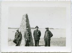 [Chief John Monais and three other Indians standing beside the James Evans memorial cairn, Norway House]