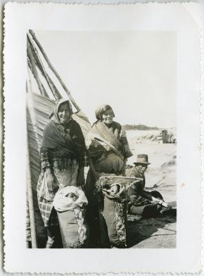 [Two Cree women watching over their swaddled infants, Norway House]