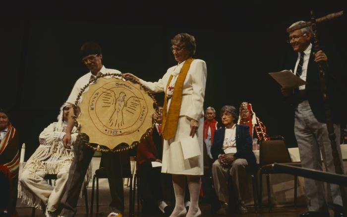 Anne Squire receiving from Alf Dumont gift for the United Church of Canada from ANCC, presented to her after the constitution of the ANCC and covenanting service.
