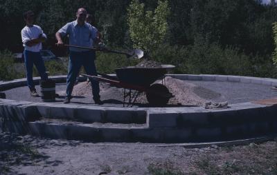 Some of the people who have gathered at the site of the cairn