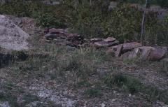 Rocks gathered from the nearby Whitefish Reserve to build circular stone wall to hold cairn.