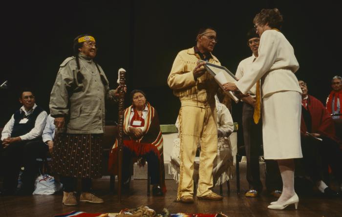 Anne Squire presenting to Murray Whetung, the Native Apology, framed, during the Service of Constitution of ANCC and Covenanting at the 32nd General Council.