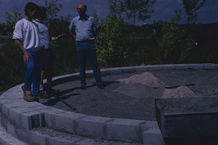 Some of the people who have gathered at the site of the cairn