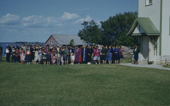 [Long shot of a group of people]