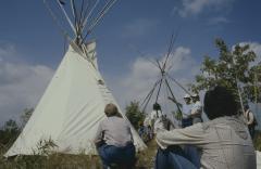 The tepees erected, admired by men and women at the 31st General Council, before the formal apology to the native people by the council.