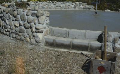 Construction of the low circular stone wall of [Apology cairn]