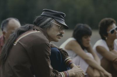 Jim Dumont, seated with others outside, waiting for the formal apology of the 31st General Council to the Native peoples.